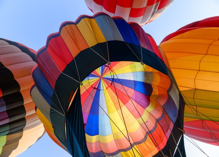 Colorful hot air balloons with igniting an inflatable in annual festival