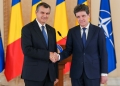 Romanian President Nicusor Dan, right, shakes hand with Prime Minister designate Eugen Tomac at the end of press statements at the Cotroceni Presidential Palace in Bucharest, Romania, Thursday, June 4, 2026.,Image: 1107736462, License: Rights-managed, Restrictions: This content is intended for editorial use only. For other uses, additional clearances may be required., Model Release: no , Pictured: Eugen Tomac,Nicusor Dan , Credit line: Vadim Ghirda / AP / Profimedia
